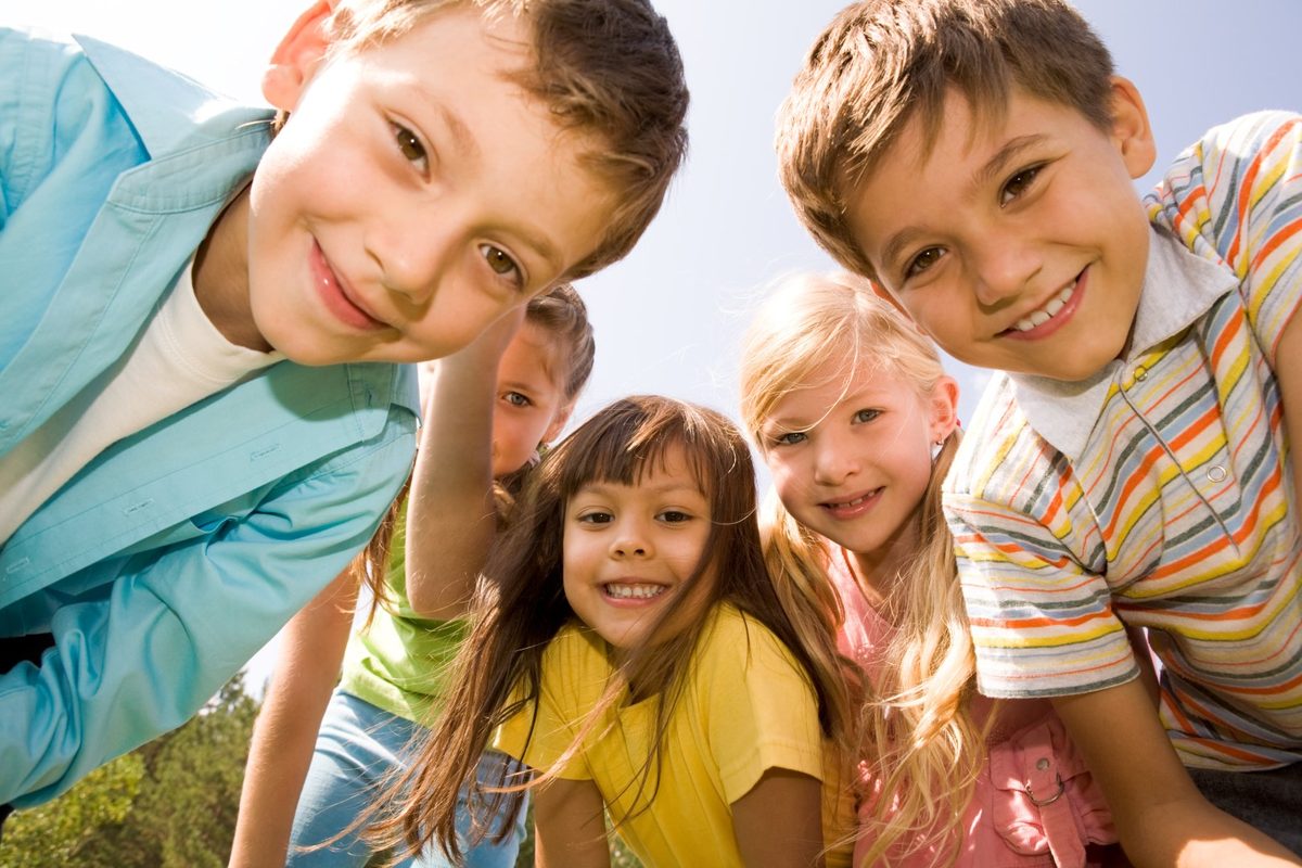 Escondido children smiling together outdoors